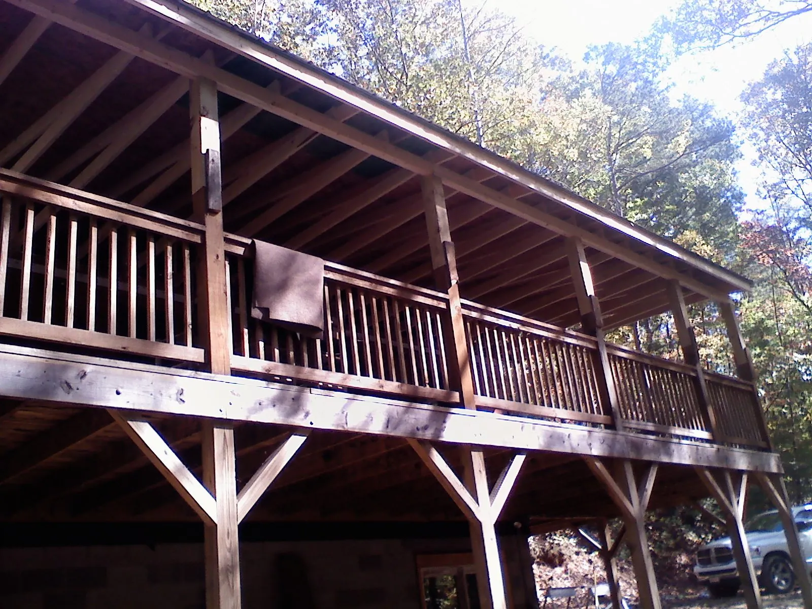 Timber framing under a new elevated porch and deck — Roof Leak Repair in Bastrop by Roofing Brothers